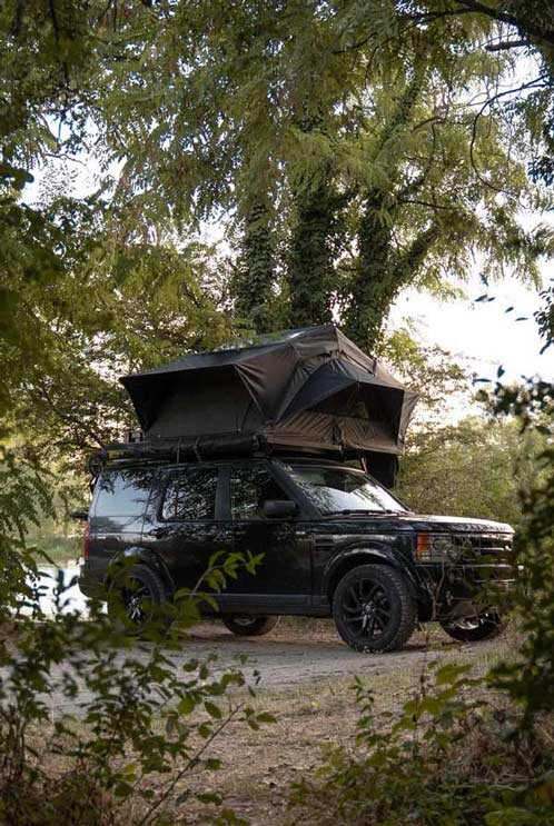 lightweight folding rooftop tent on range rover