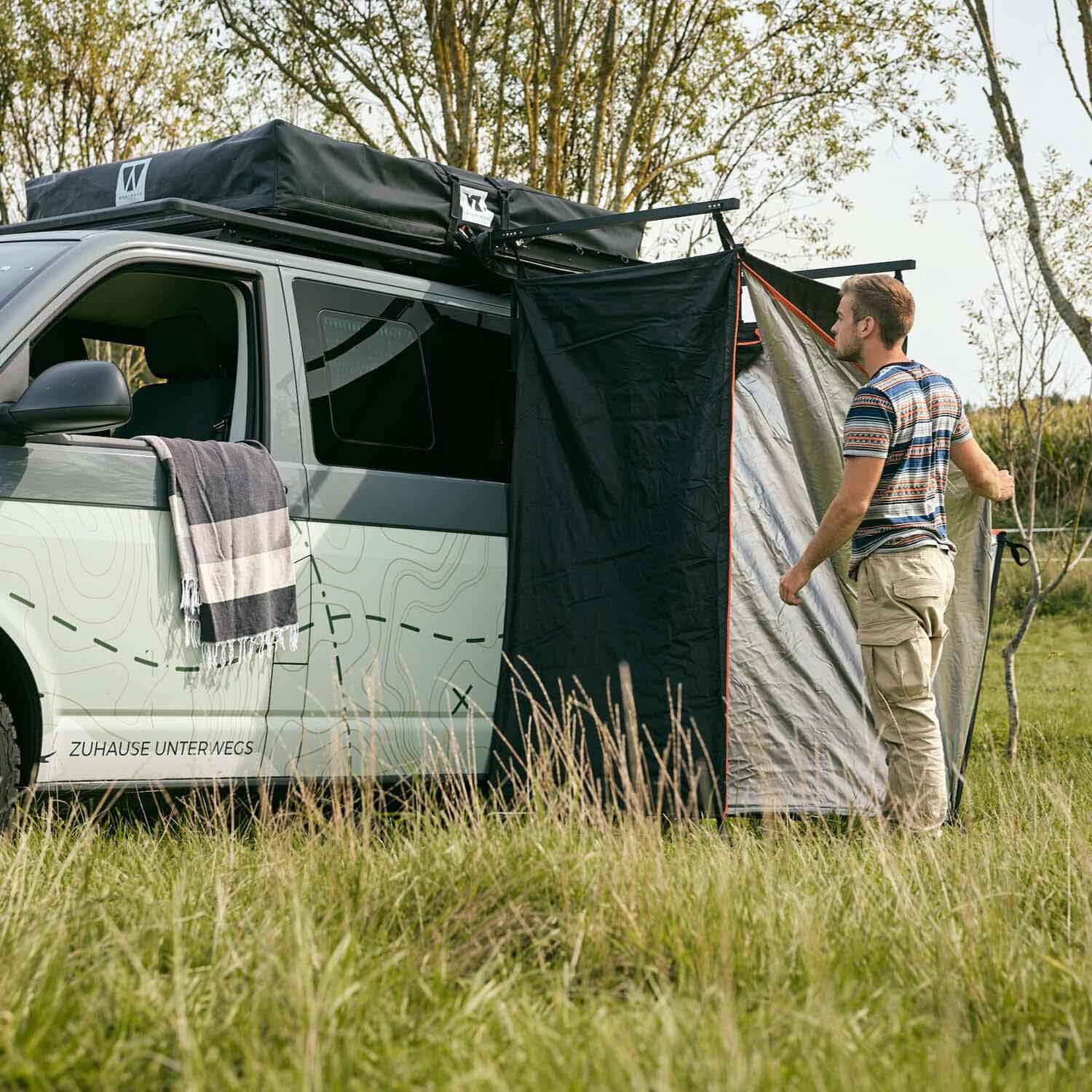 VICKYWOOD shower tent set up by the vehicle in camp